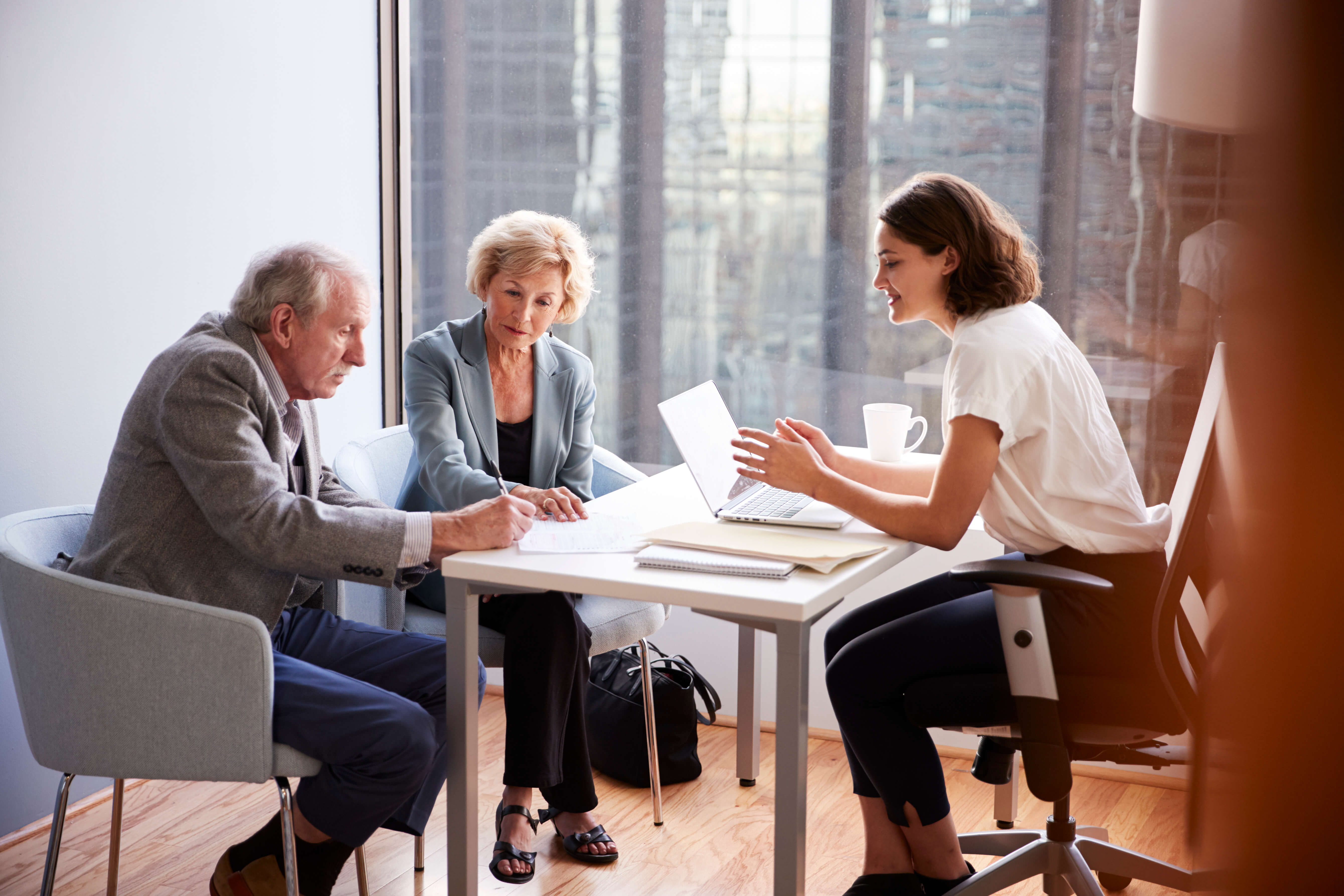 Couple meeting with an estate planning lawyer.