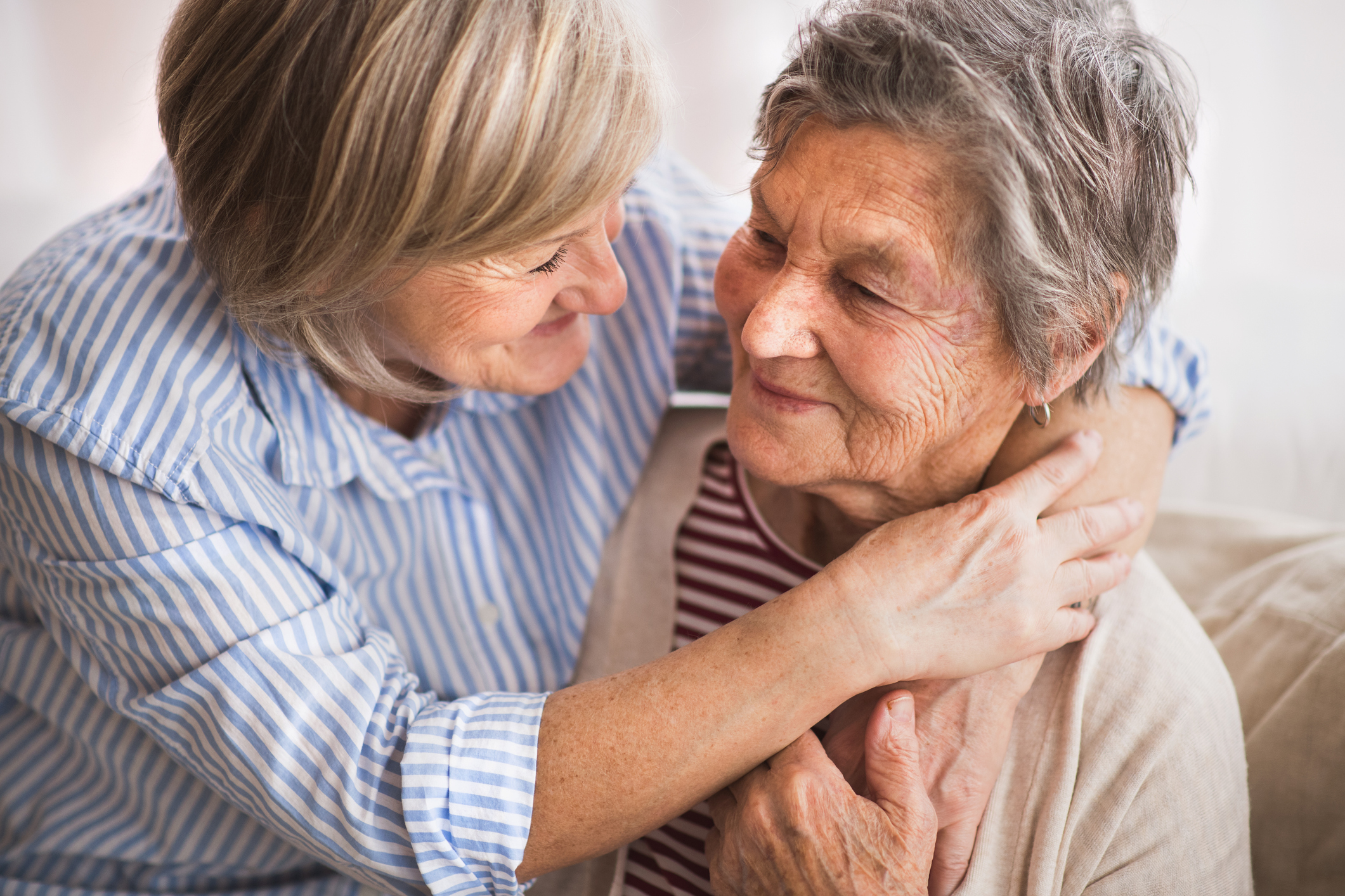 Woman taking care of elderly loved one
