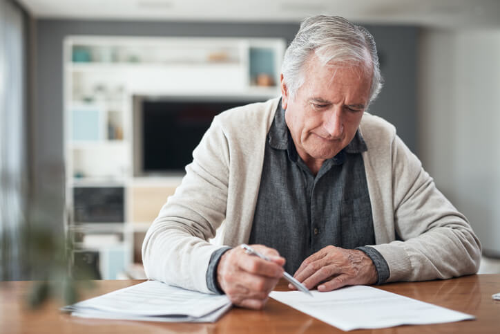 Elderly man working on his estate plan