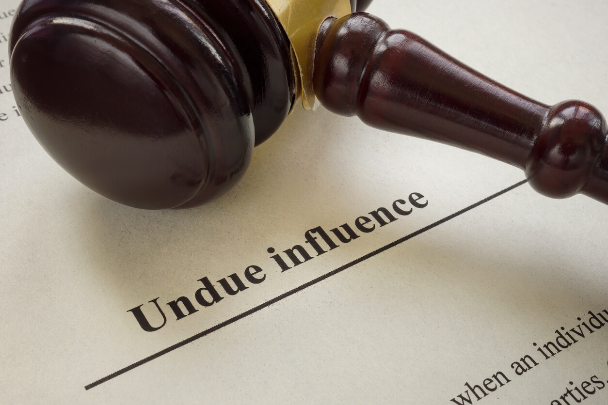 Info about undue influence and a gavel near.